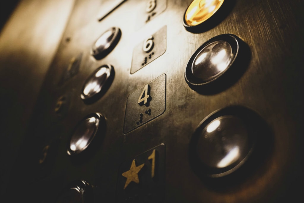 An elevator panel with buttons.